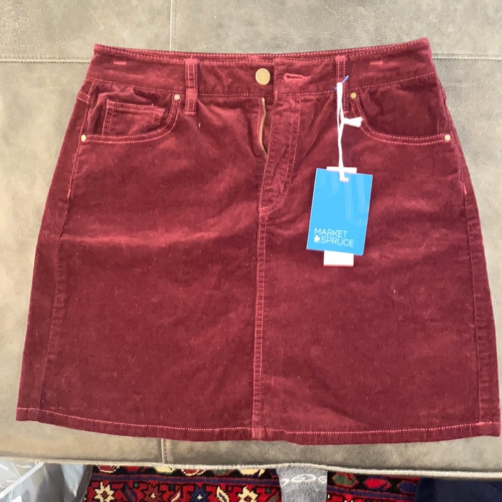 Red denim skirt. Darker than the picture shows.